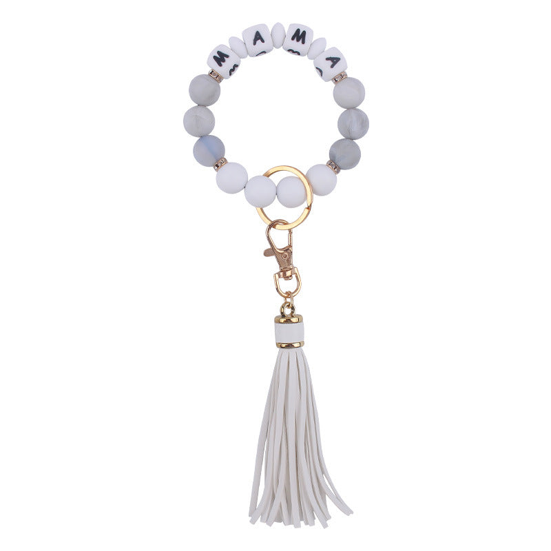 Venta al por mayor Llavero de muñeca con cuentas de estampado de leopardo de silicona